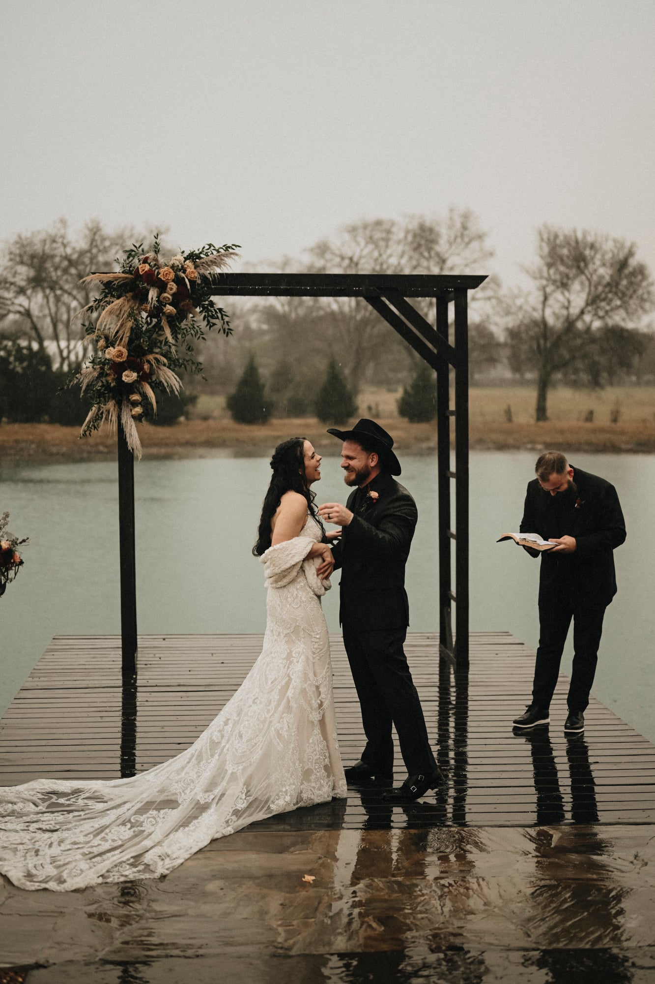 Bride and groom laughing together during their dockside ceremony