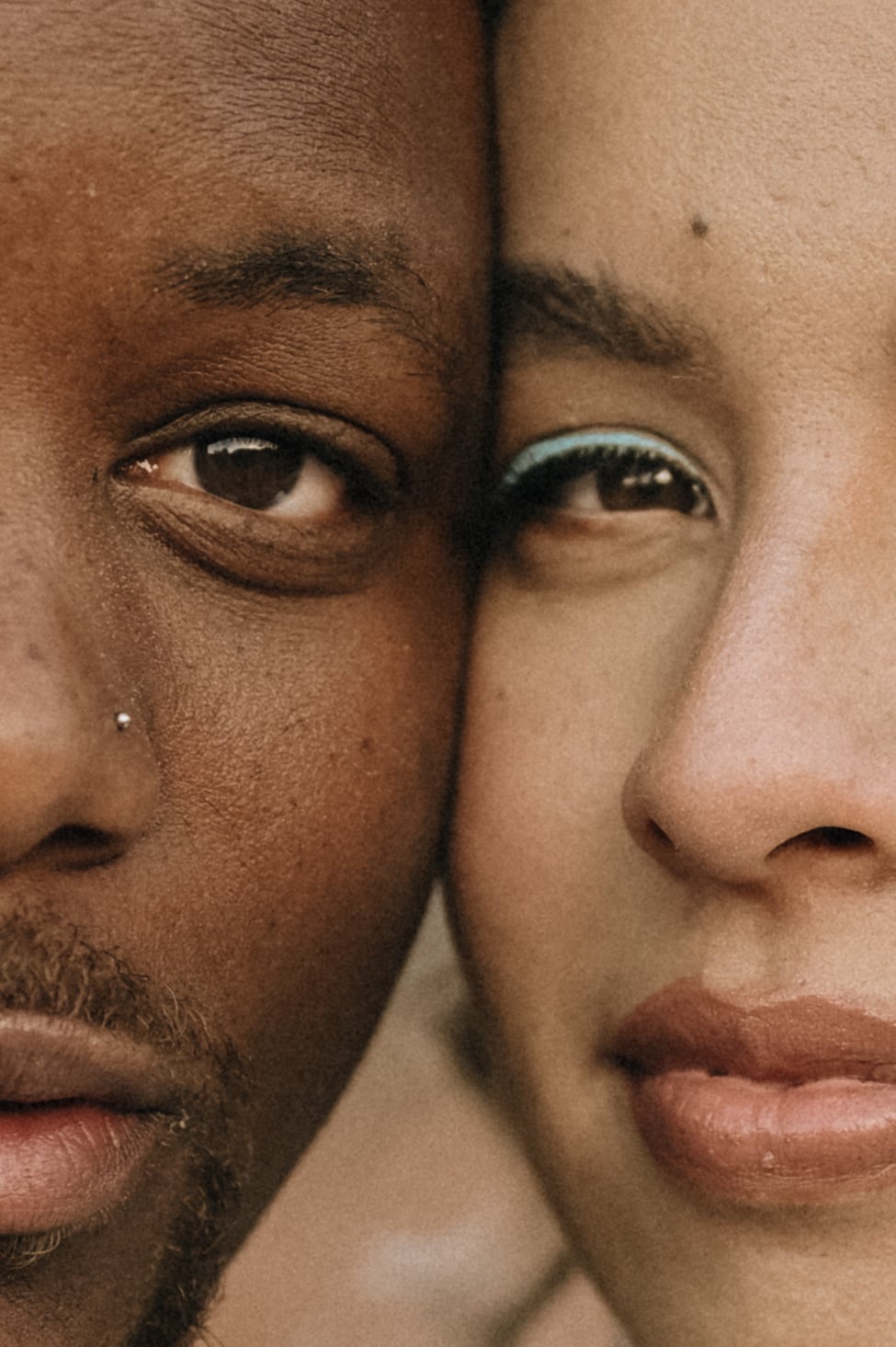Close-up portrait of a couple with their faces pressed together
